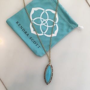 Kendra Scott gold necklace with turquoise pendant